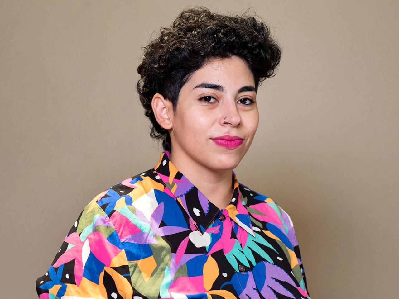 Portrait of woman in colourful shirt