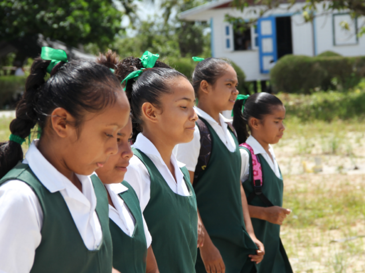 Five female students walking in a line