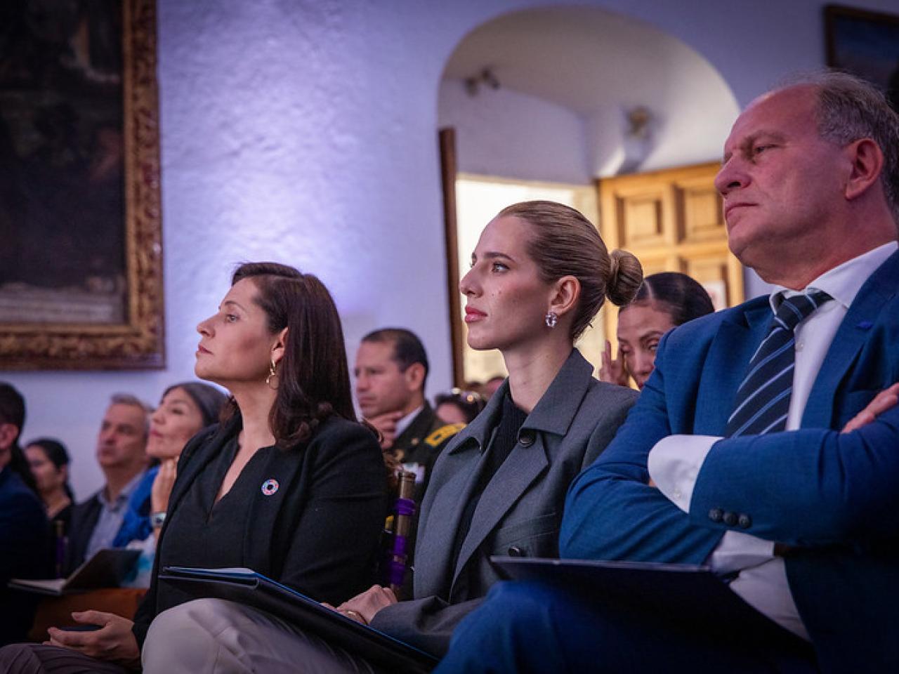 Seated crowd watching stage