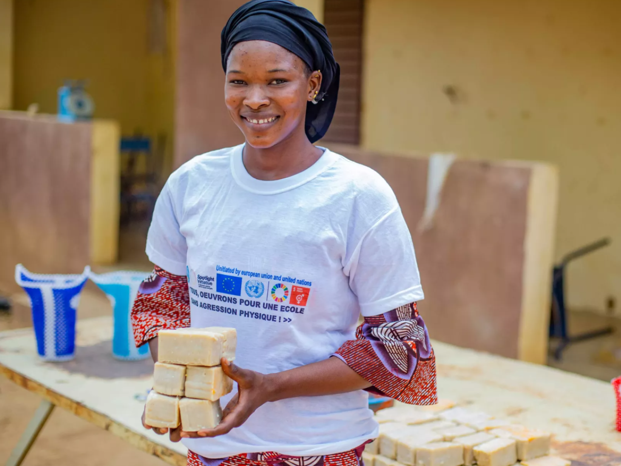 Girl in white t-shirt holding soap