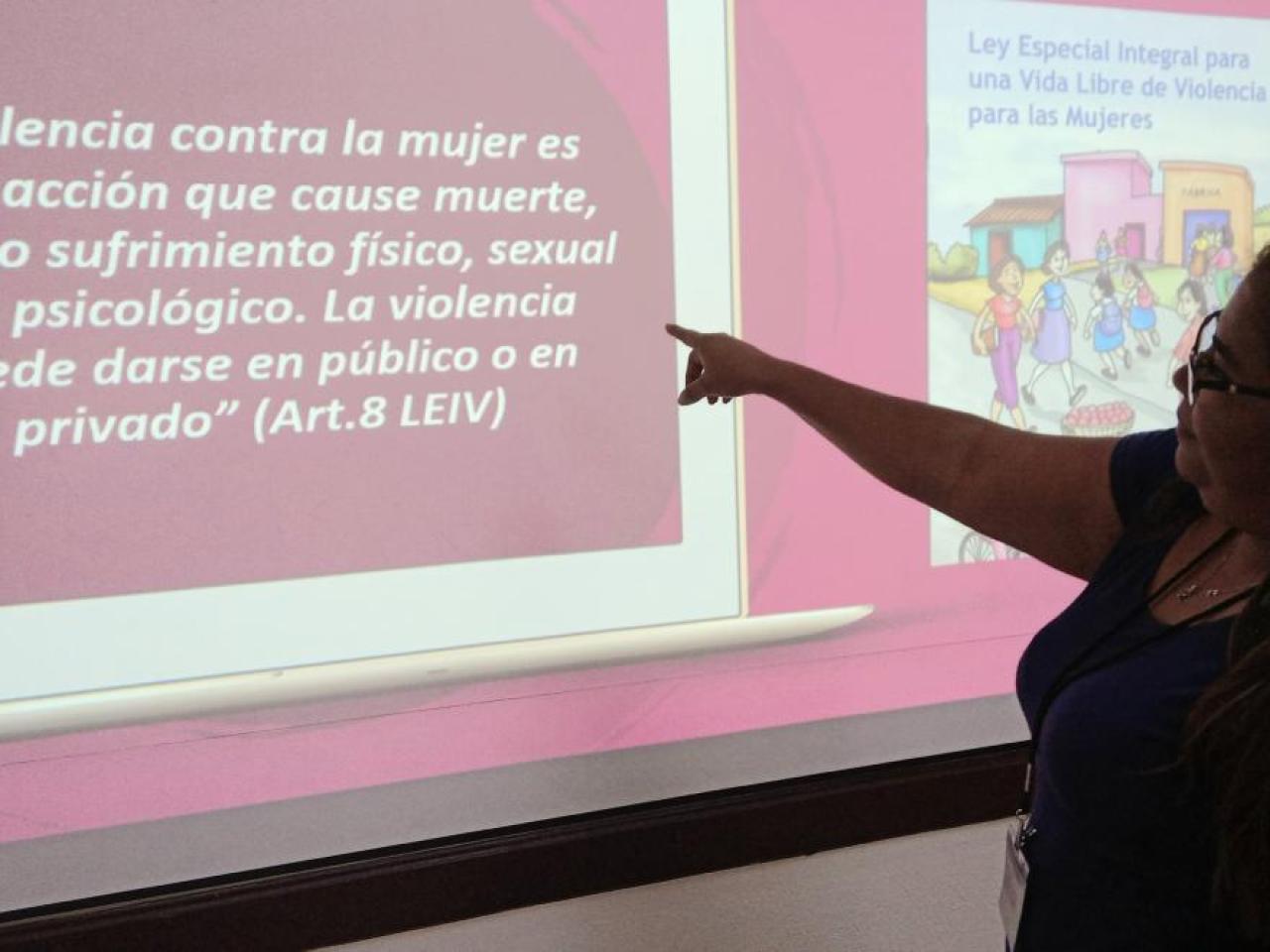 woman pointing at a screen