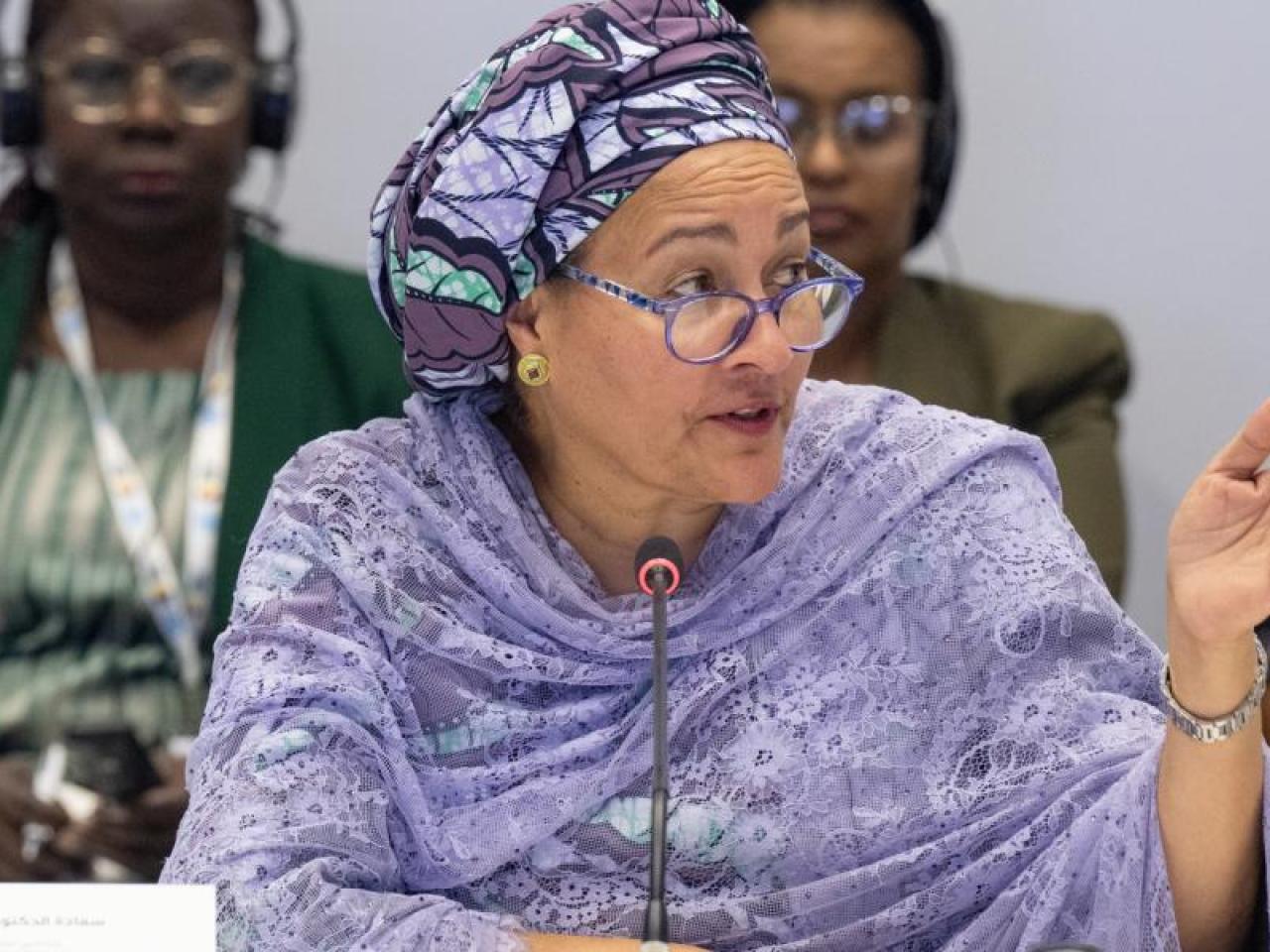 UN Deputy Secretary General Amina Mohammed speaking into a microphone