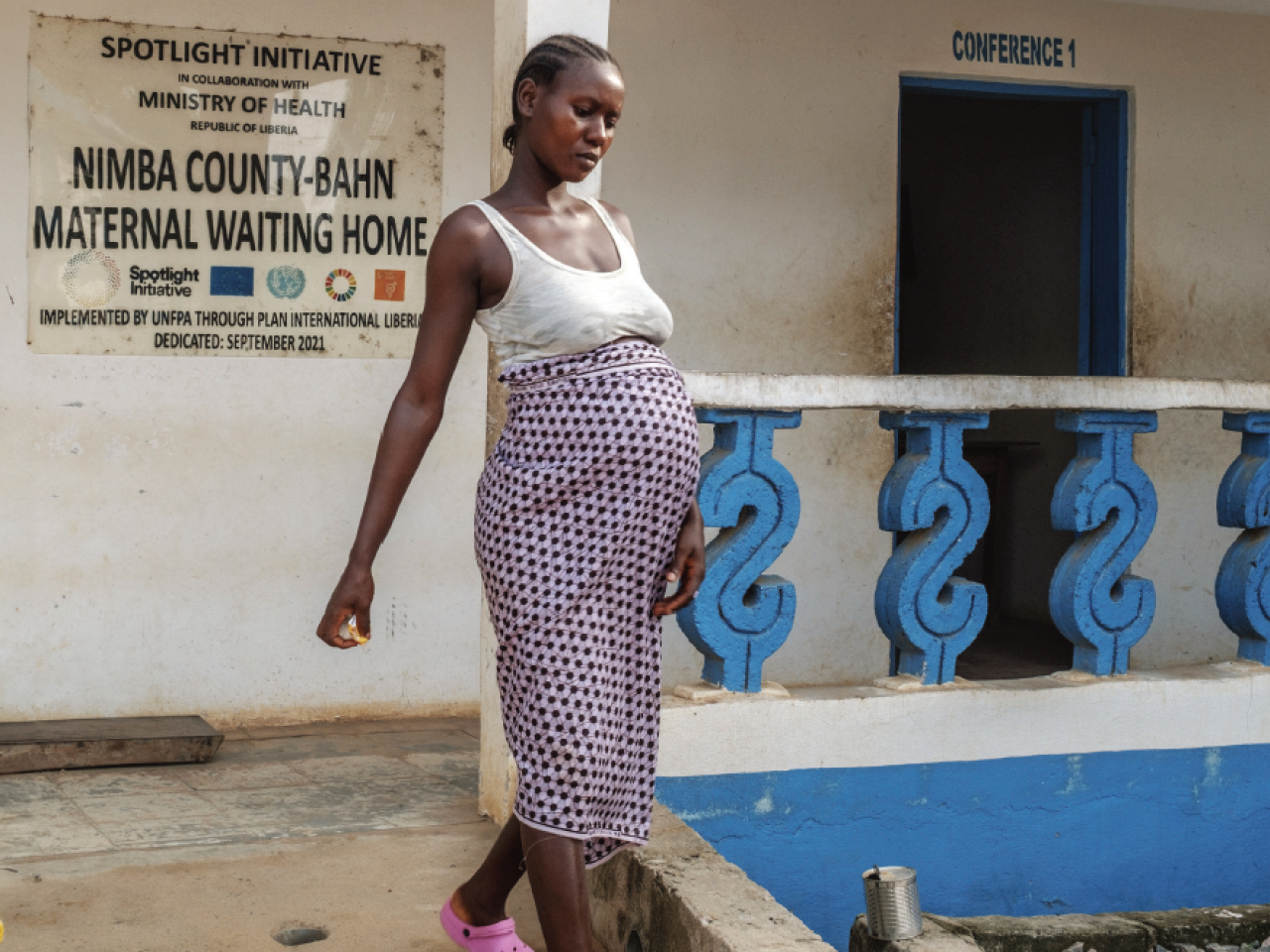 A pregnant woman leaving the maternal health centre