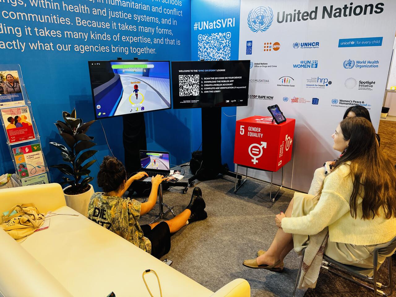 A gamer plays Sync or Storm at an SVRI stall