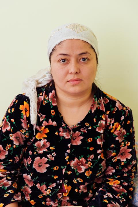 Woman in head scarf and shirt