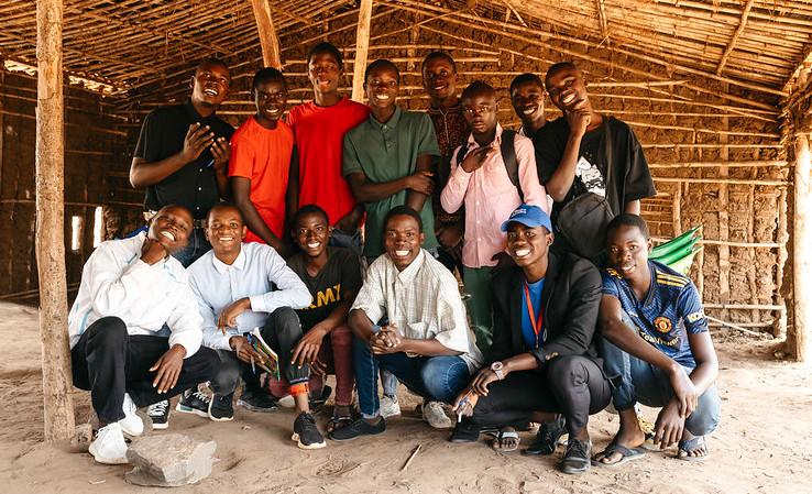 Group of men and boys posing for photo