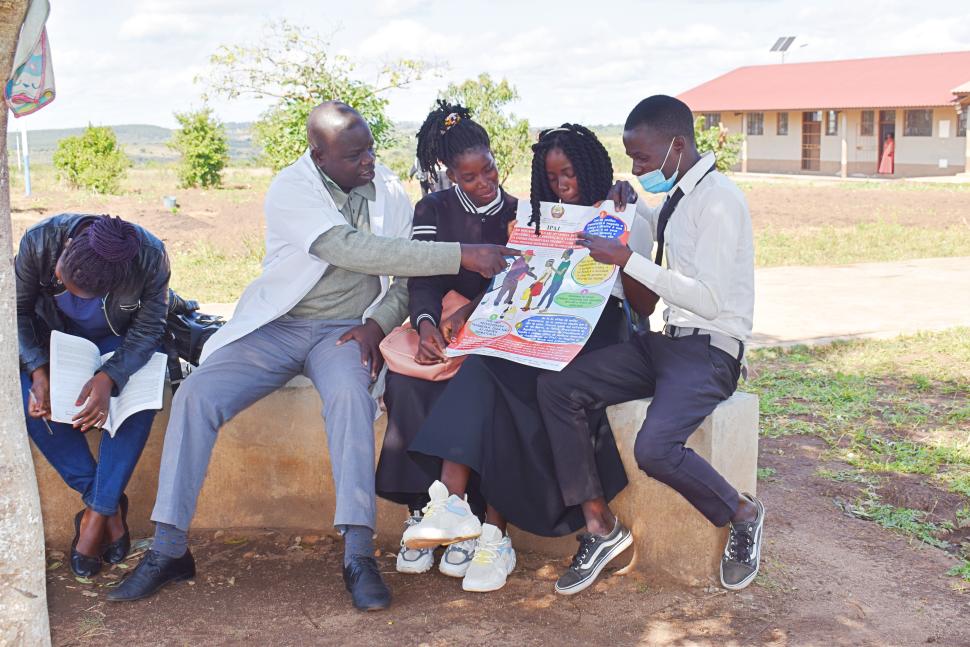 Mr Francisco, teacher, talk to his students about GBV and harmful practices 