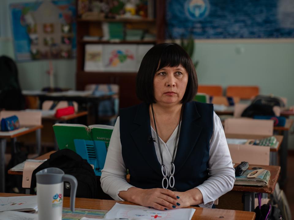 Meerim sitting in a classroom of Secondary School 2