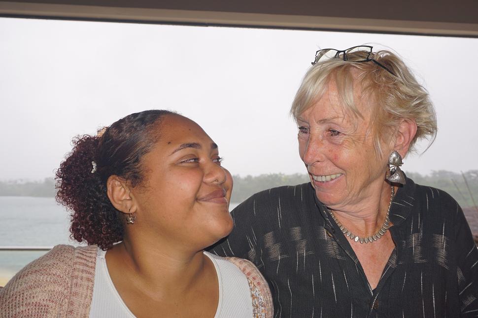 Two women exchanging smiles.