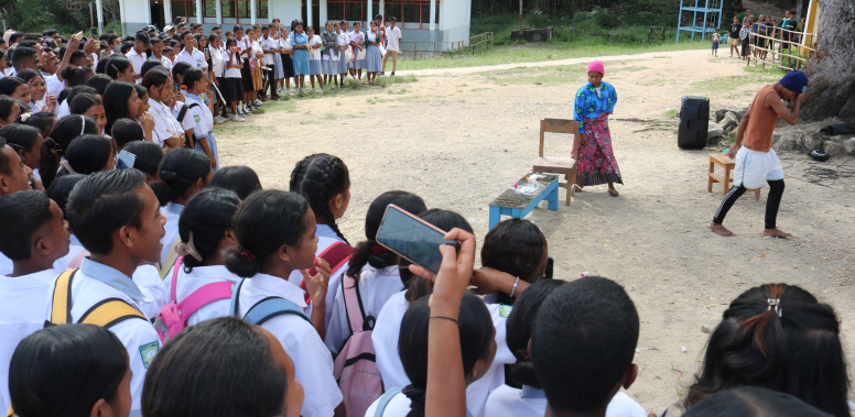 School students watching a play