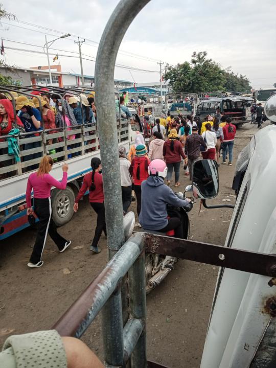 Women board cramped trailers