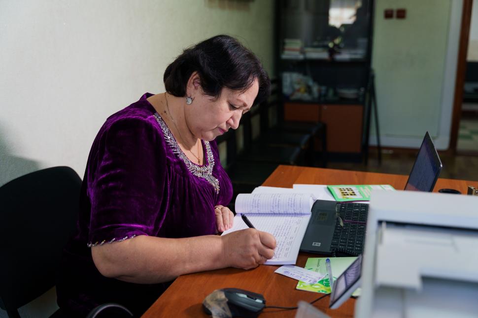 Woman writing at desk