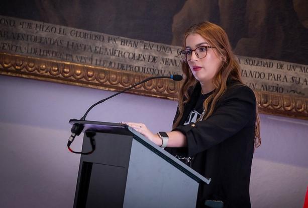 Woman speaking at lectern