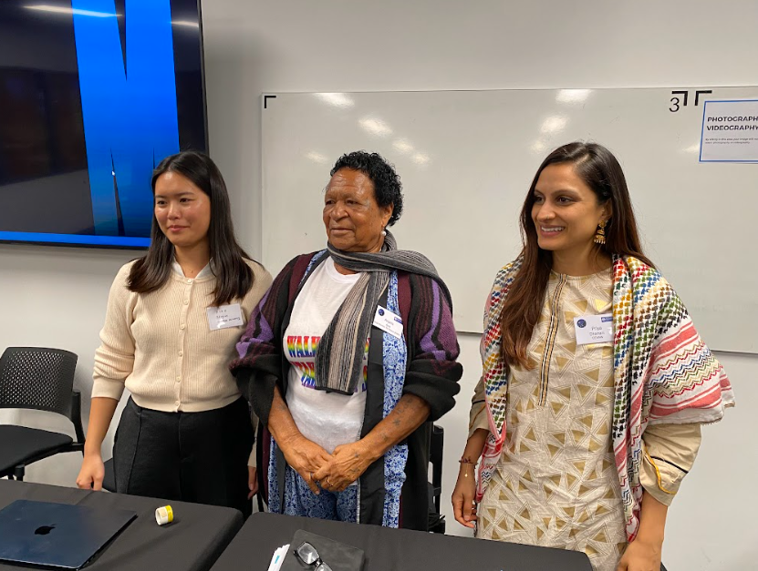 Angela Apa standing with panellists