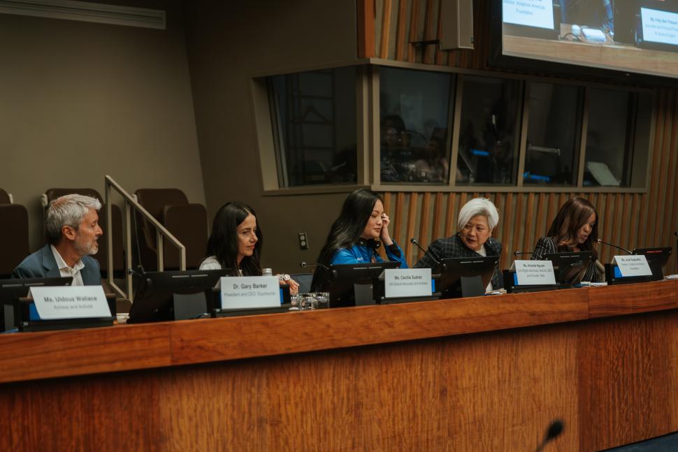 Panellists seated in a conference room