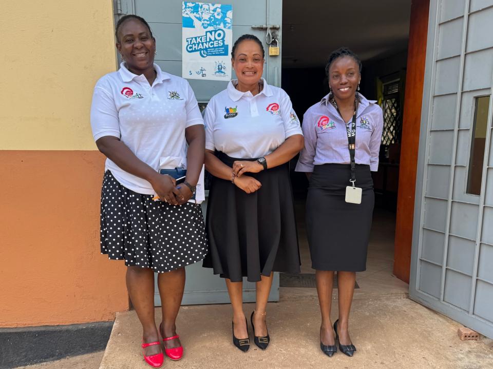 Three female counsellors smiling in doorway