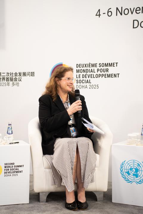 Erin Kenny seated on stage