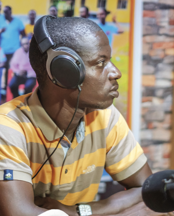 Emmanuel S Woleh wearing headphones