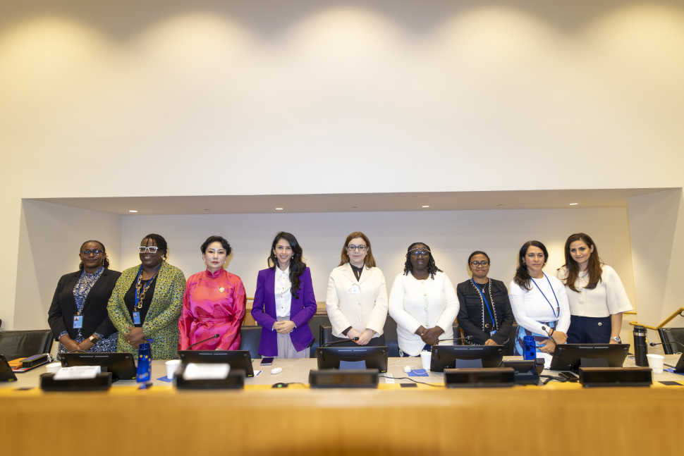 Speaker standing behind panel