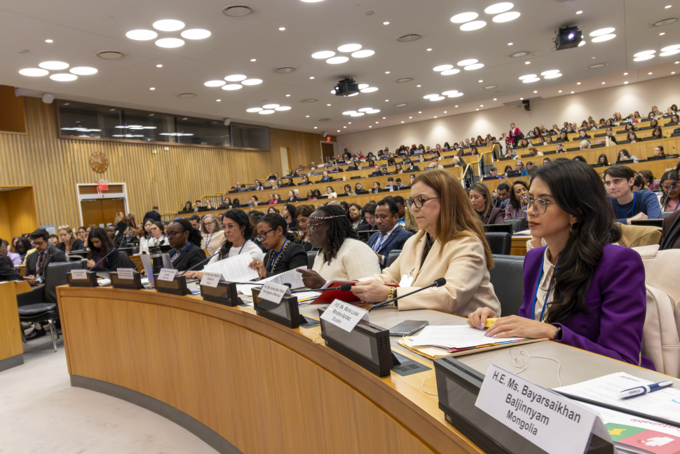 Panellists seated in conference room 