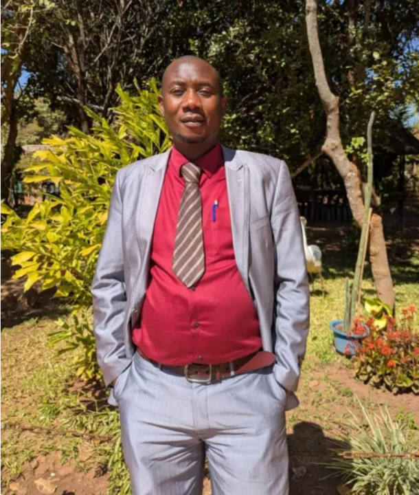 Mr Nkonde standing with hands in pockets outside