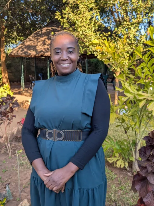 Ms Banda smiling at the camera