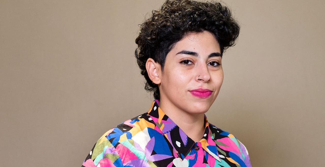 Portrait of woman in colourful shirt