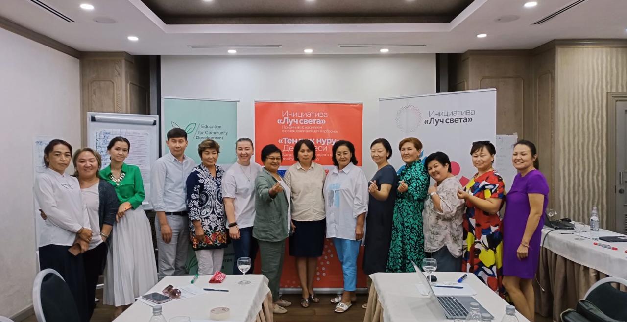 Gulmairam (second from the left) promotes violence-free relationships in families and communities. Photo: Gulmairam Egemberdieva