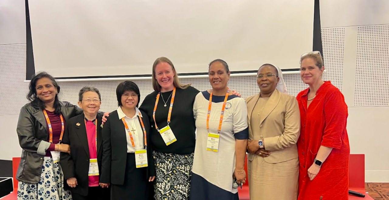 7 women smiling at camera