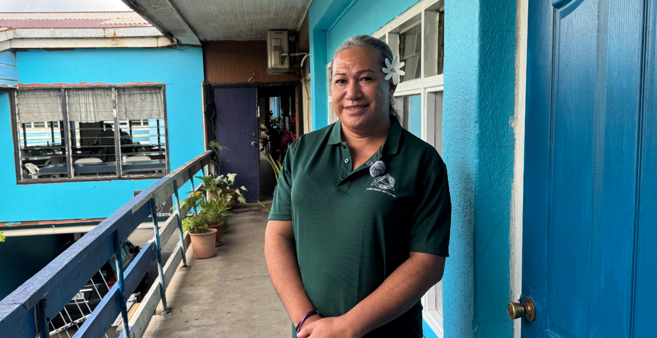 Fagalima standing on a balcony at SFA office
