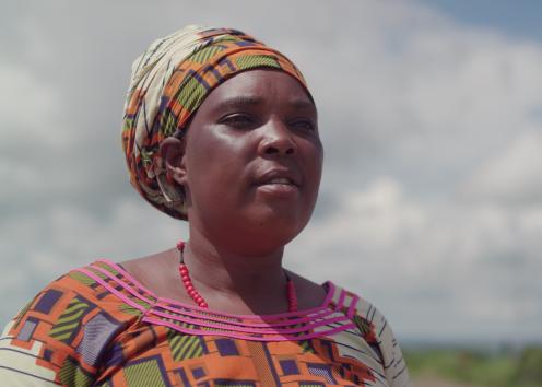 A woman in brightly coloured dress and matching