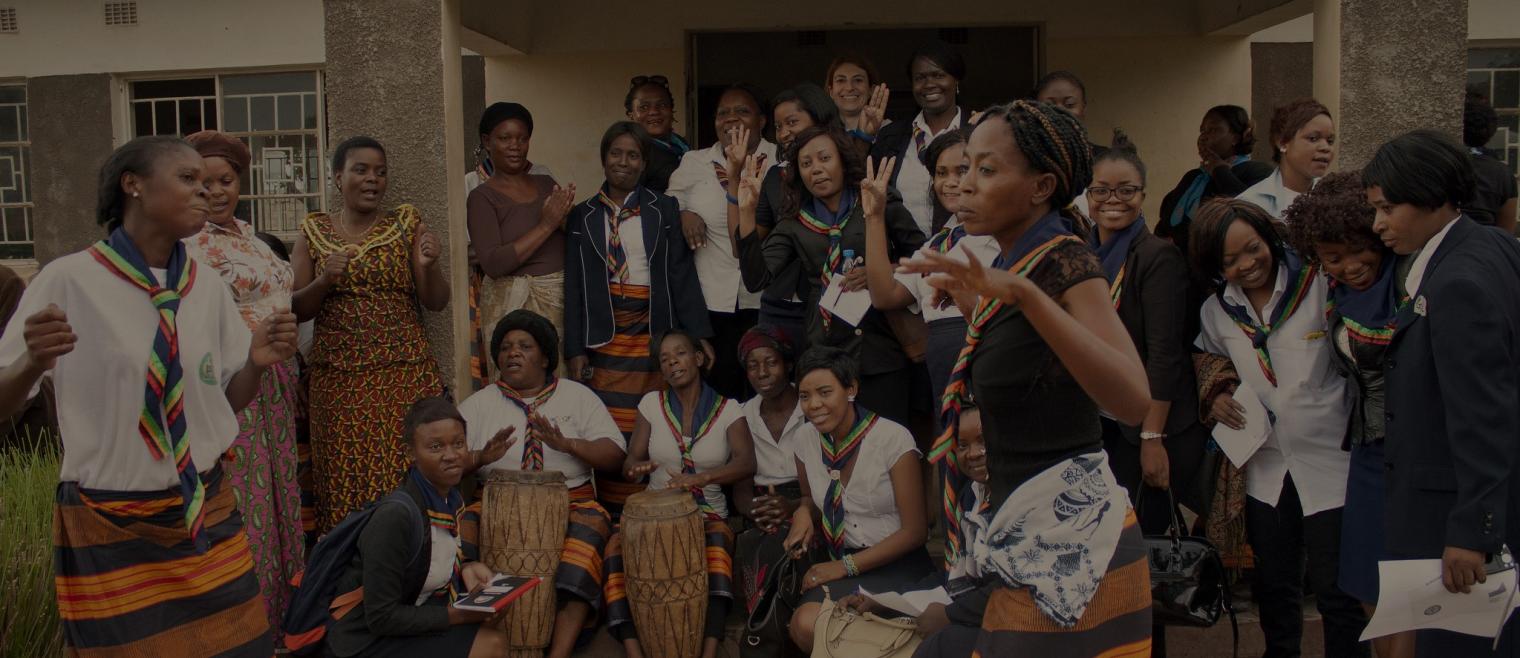 Women dancing and playing drums