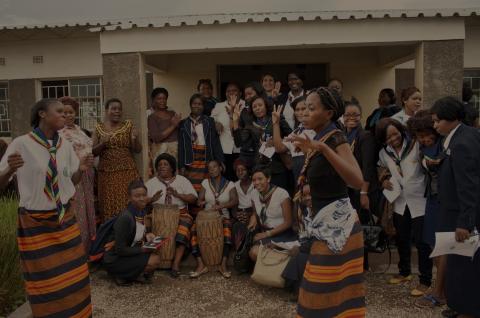 Women dancing and playing drums